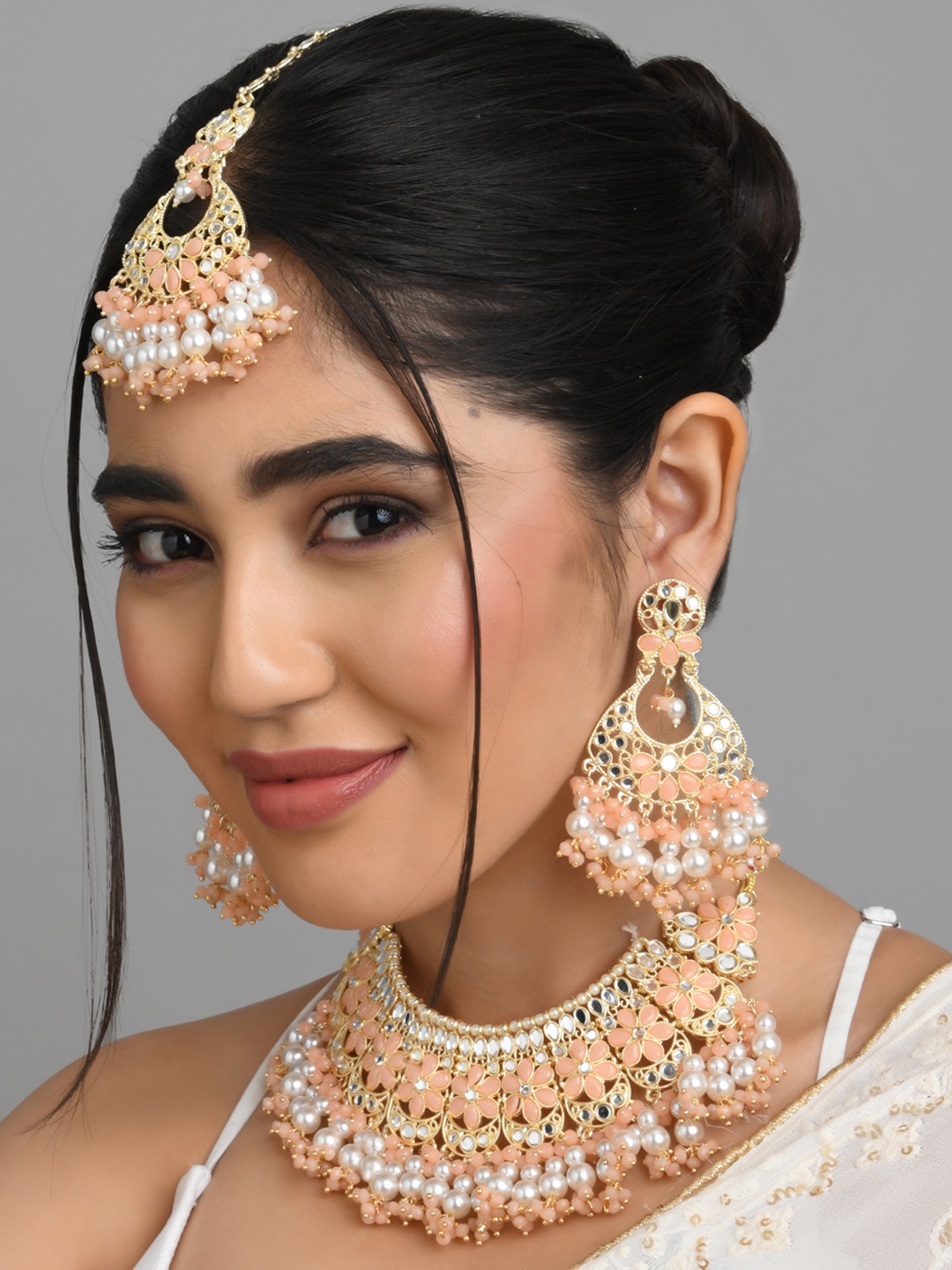 

Fida Gold-Plated Peach-Coloured Kundan Studded Jewellery Set