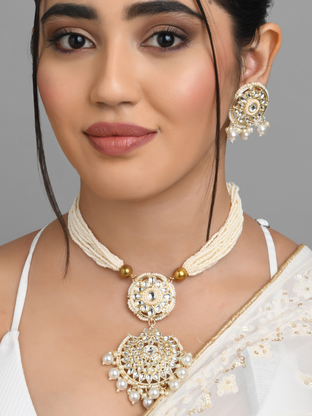 

Fida Women Gold-Plated White Stone-Studded & Beaded Jewellery Set