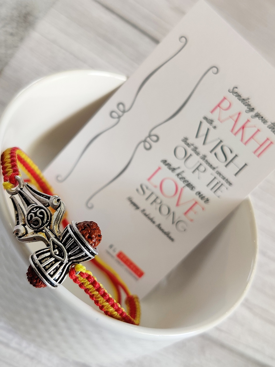 

EL REGALO Yellow Om Wraparound Rakhi