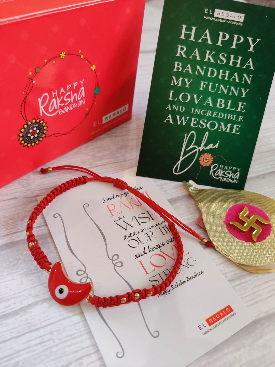 

EL REGALO Red & Gold-Toned Rakhi Gift Set with Roli Chawal & Greetings Card