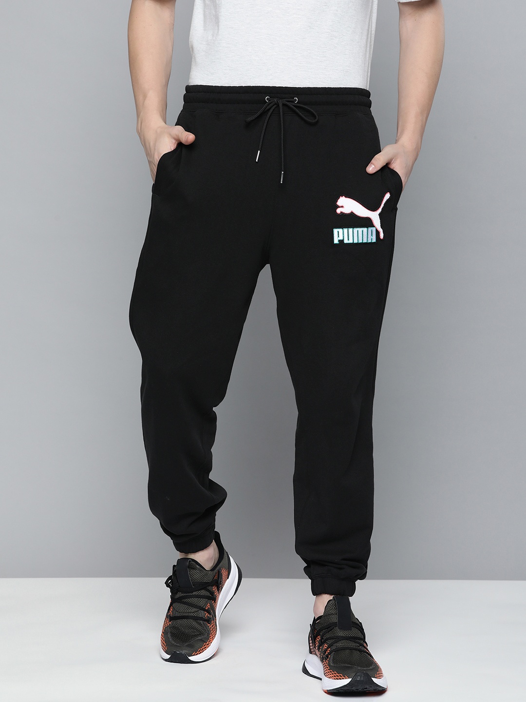 

Puma Men Solid Relaxed Fit Mid-Rise Pure Cotton Fandom Sweatpants Joggers With Applique, Black