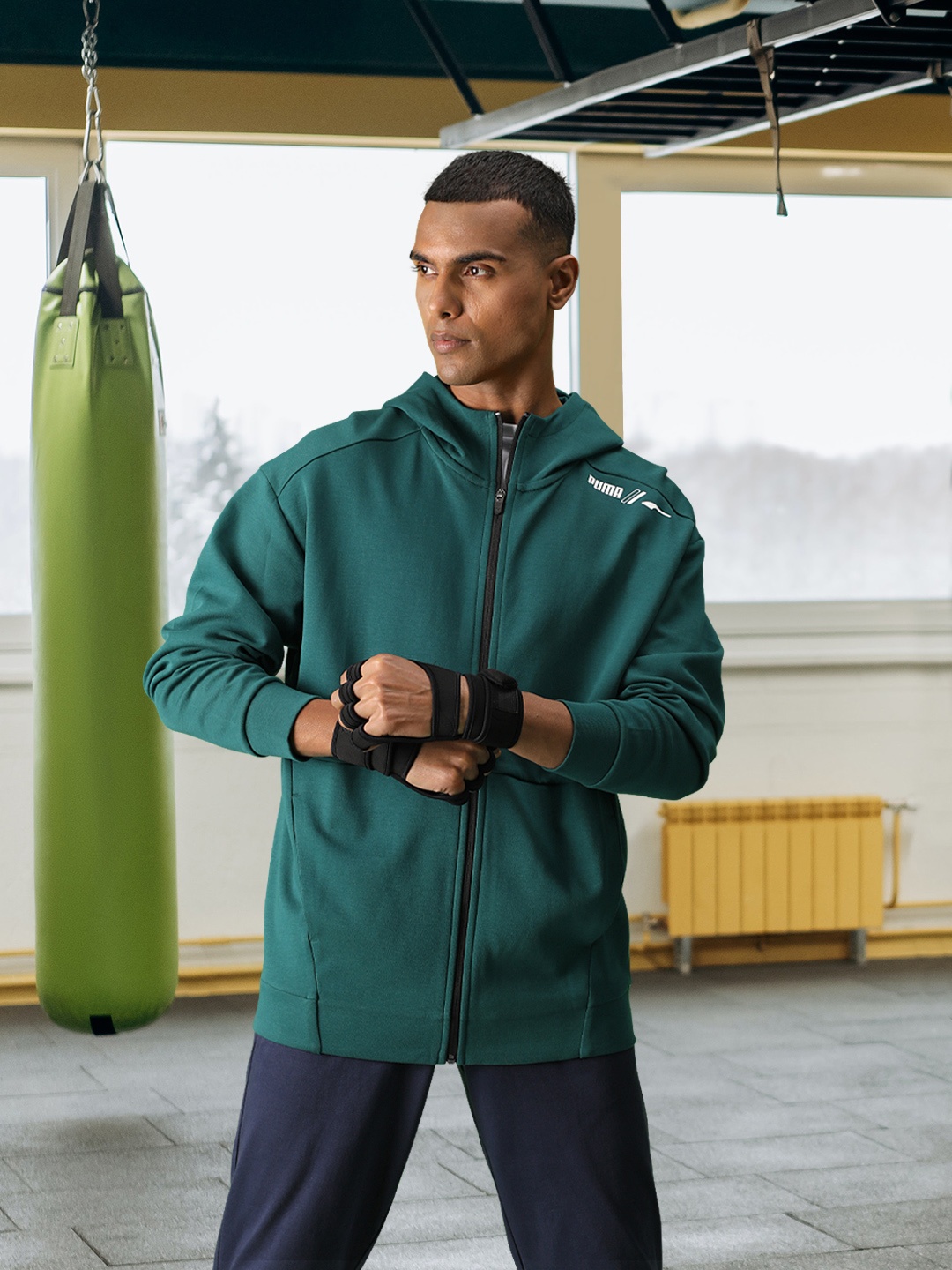 

Puma Men Green Solid Relaxed Fit Hooded Sporty Jacket