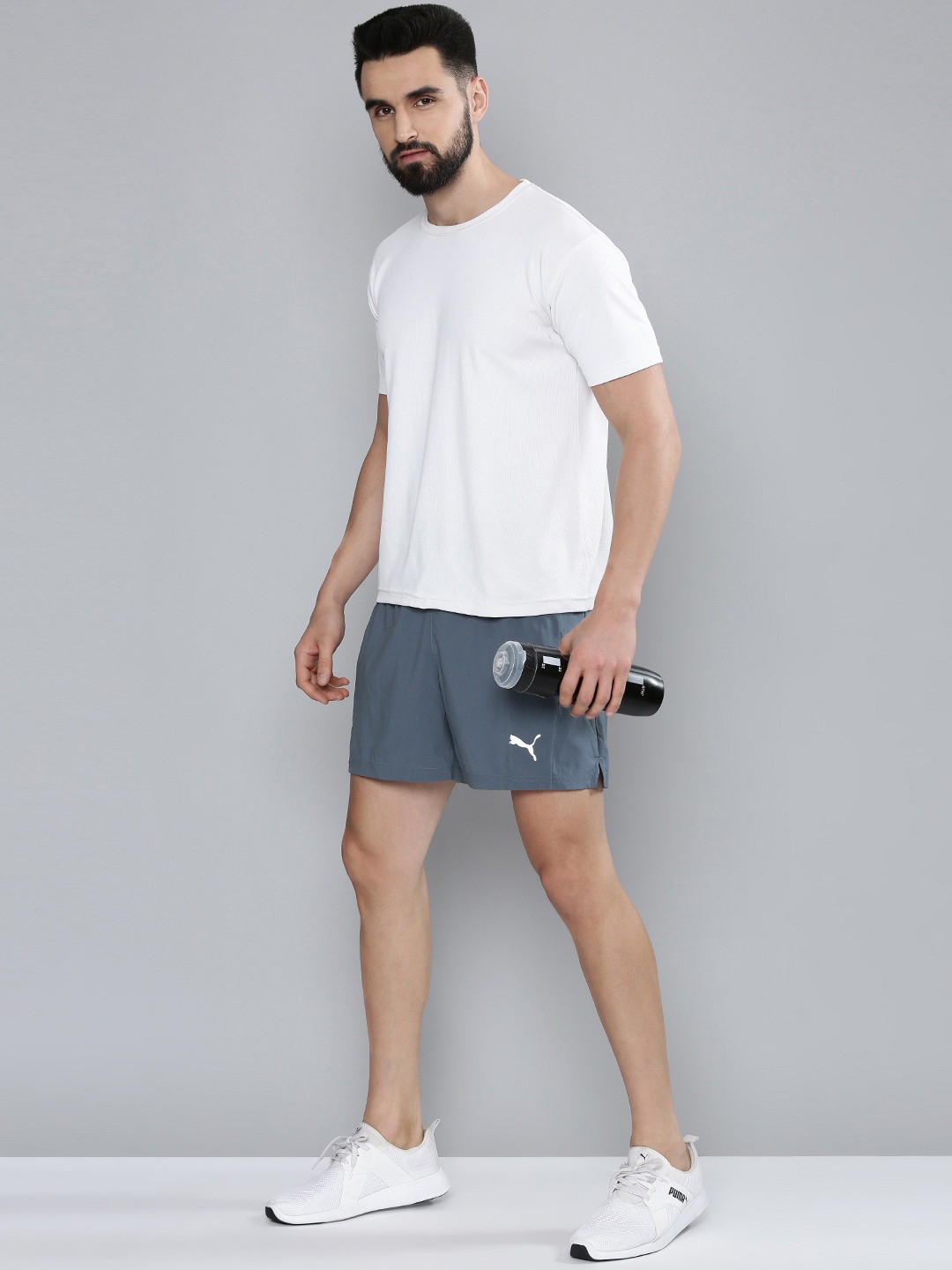 

Puma Men Grey Solid Mid-Rise Favourite Woven 5" Session Running Sports Shorts