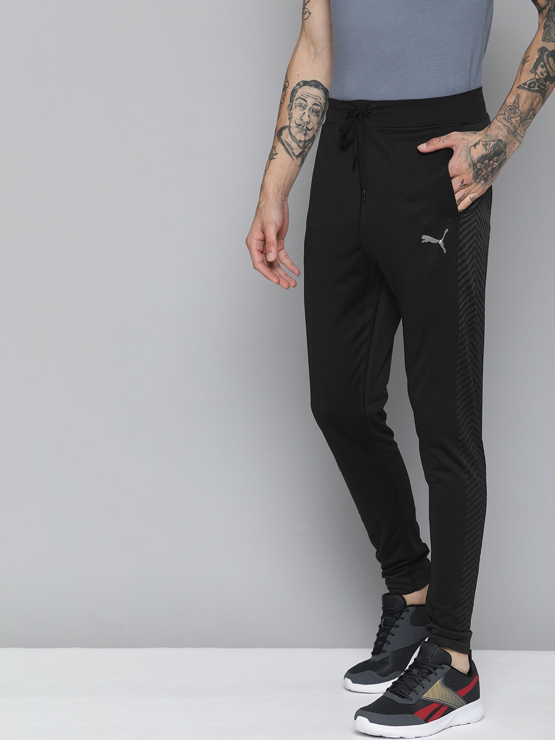 

Puma Men Brand Logo Printed Slim Fit FORMKNIT SEAMLESS Joggers With Printed Sides, Black