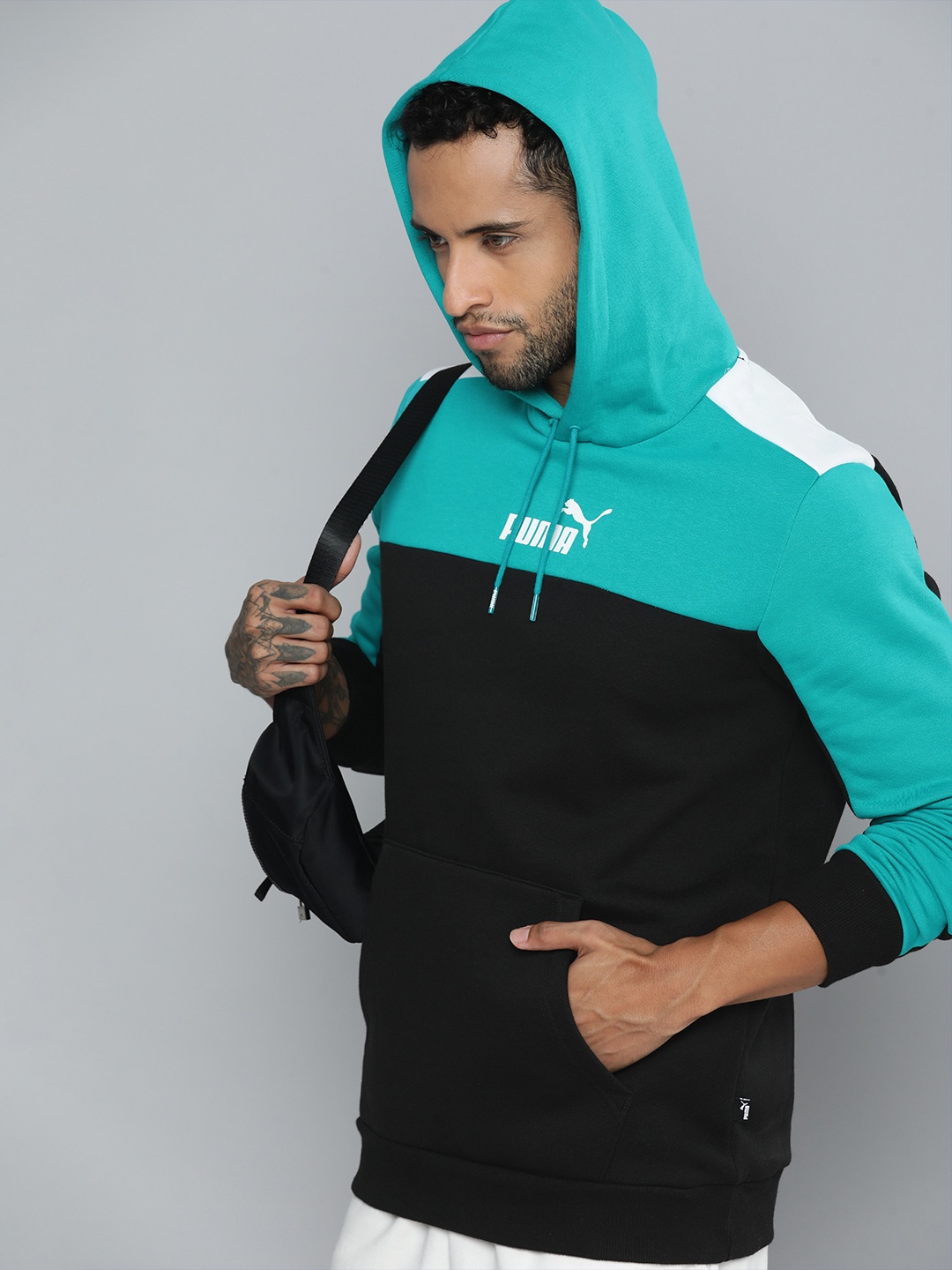 

Puma Men Black & Turquoise Blue Hooded Essential+ Colourblocked Regular Fit Sweatshirt