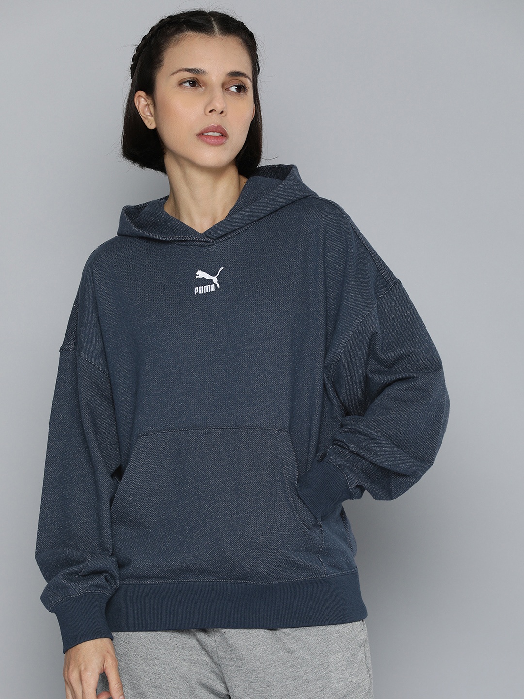 

Puma Women Blue Self Designed Casual Hooded Sweatshirt