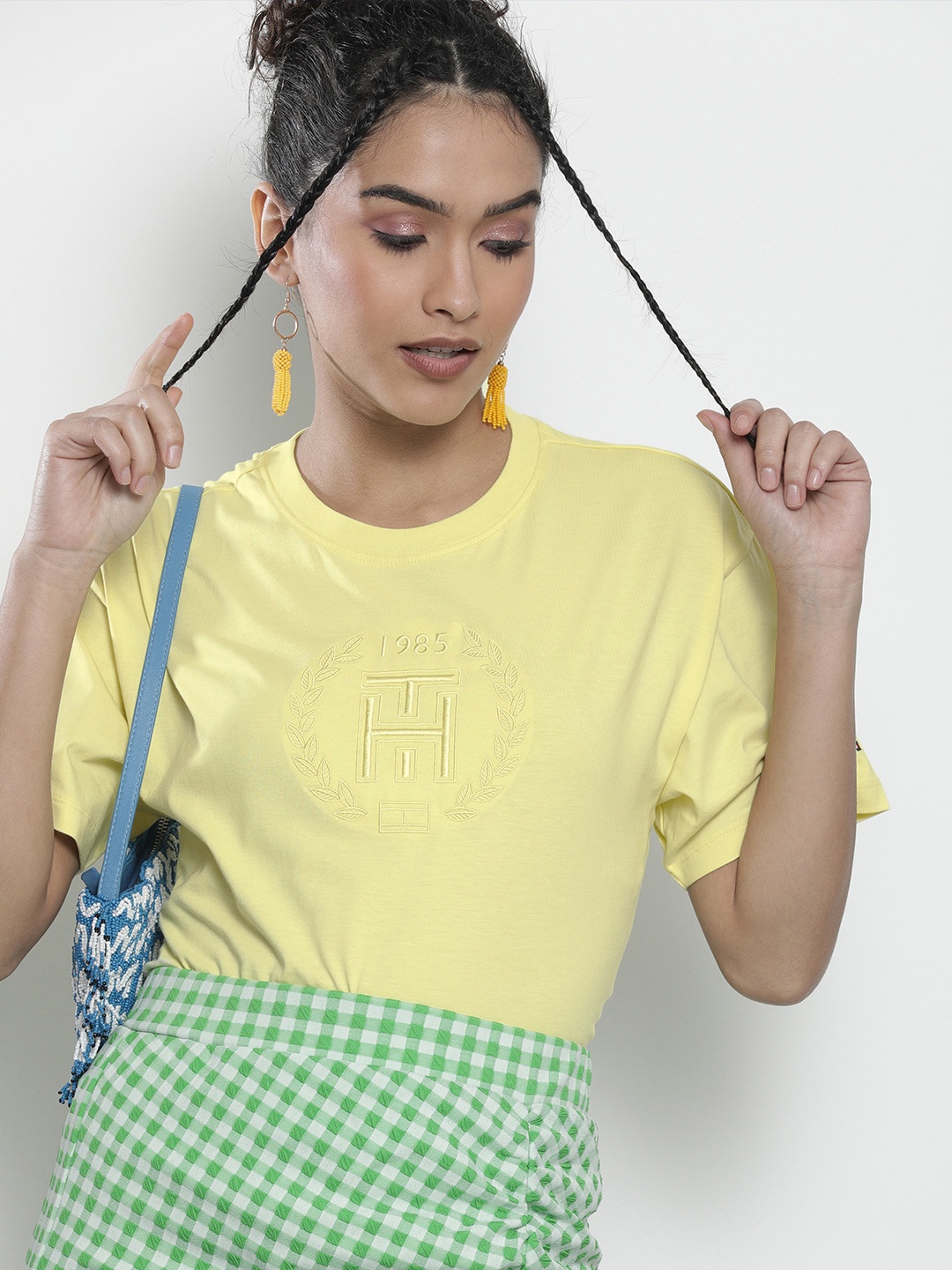 

Tommy Hilfiger Women Yellow Solid Drop-Shoulder Sleeves Applique Pure Cotton T-shirt
