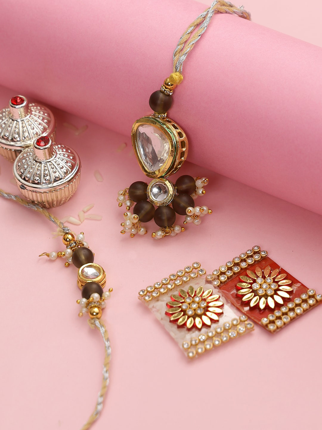 

Aapno Rajasthan Set Of 2 Brown & Gold-Toned Stone Studded Rakhi