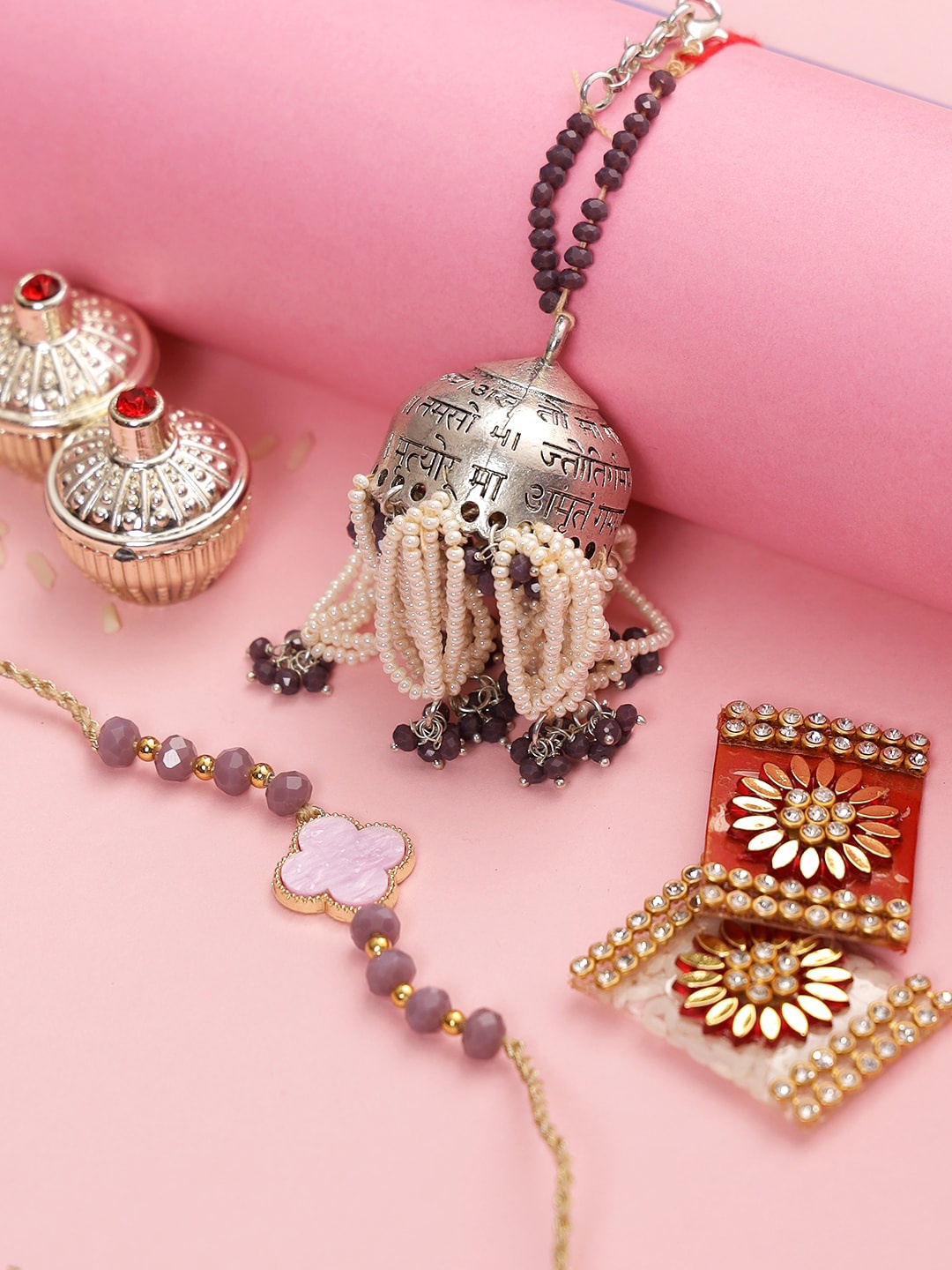 

Aapno Rajasthan Gold Toned Mantra Engraved Bhaiya Bhabhi Rakhi Set