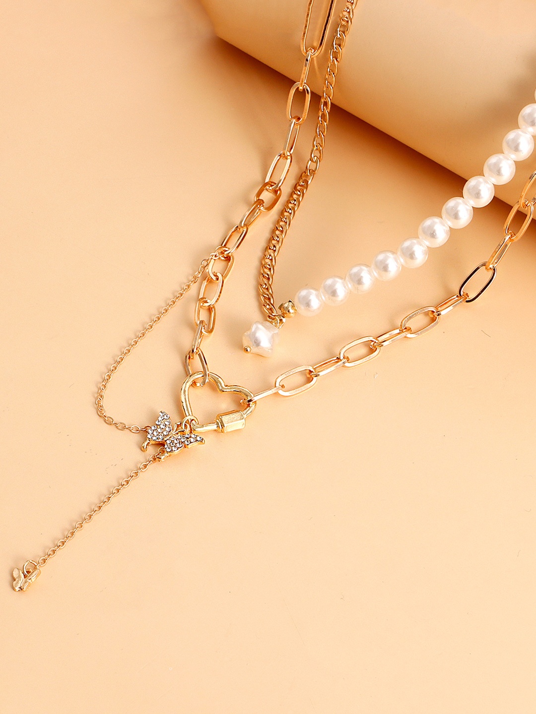 

Yellow Chimes Gold-Plated & White Pearl Studded Heart Charm Layered Necklace