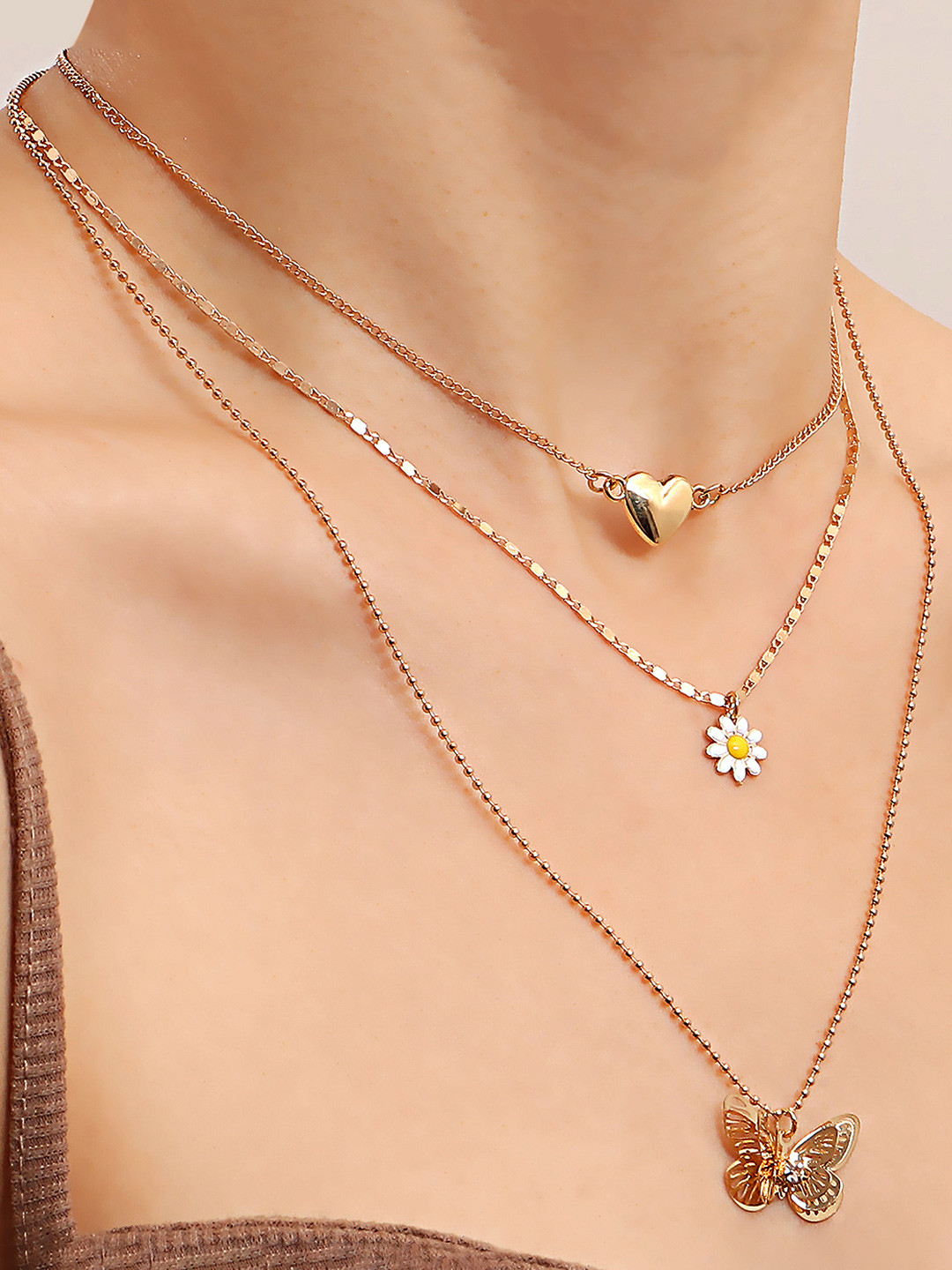 

Yellow Chimes Gold Toned Heart Shape Flower Diasy Butterfly Charm Multi Layered Neckchain