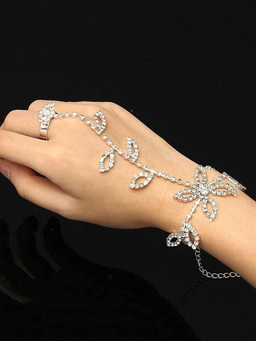 

Unwind by Yellow Chimes Women Silver-Toned Crystal studded Floral Bracelet With Ring