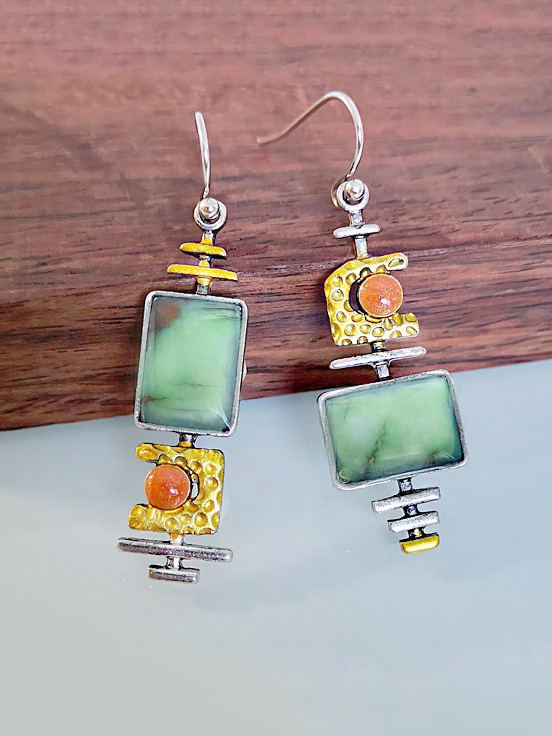 

Unwind by Yellow Chimes Silver Plated Green Stone Studded Mismatch Dangler Earrings