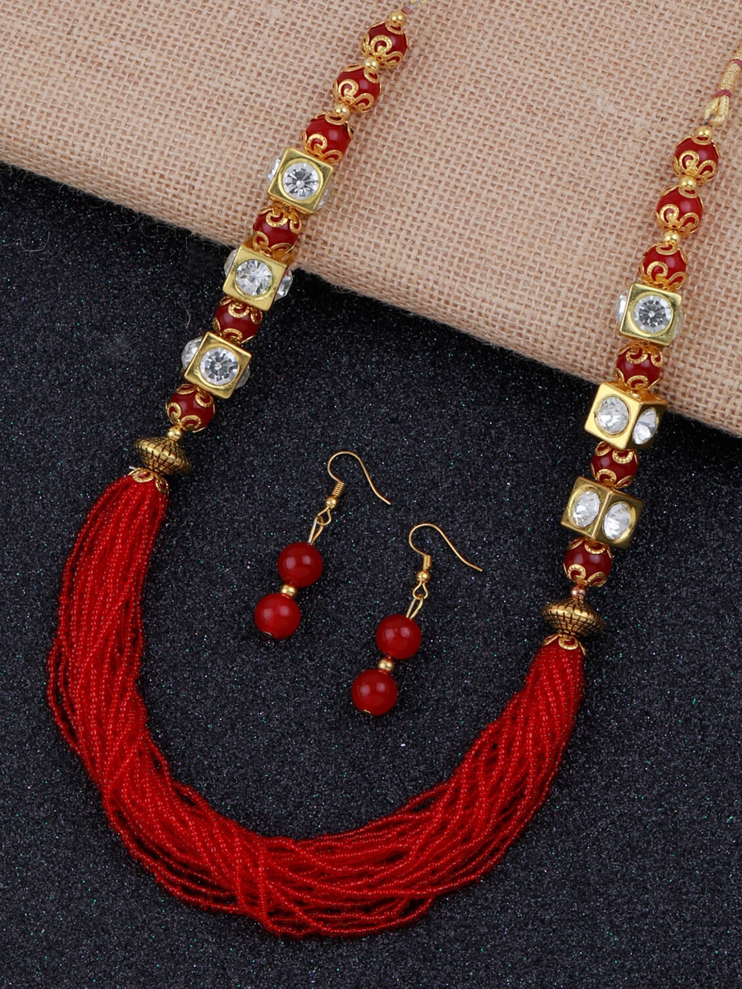 

Silver Shine Women Gold-Plated Red Stone-Studded & Beaded Jewellery Set