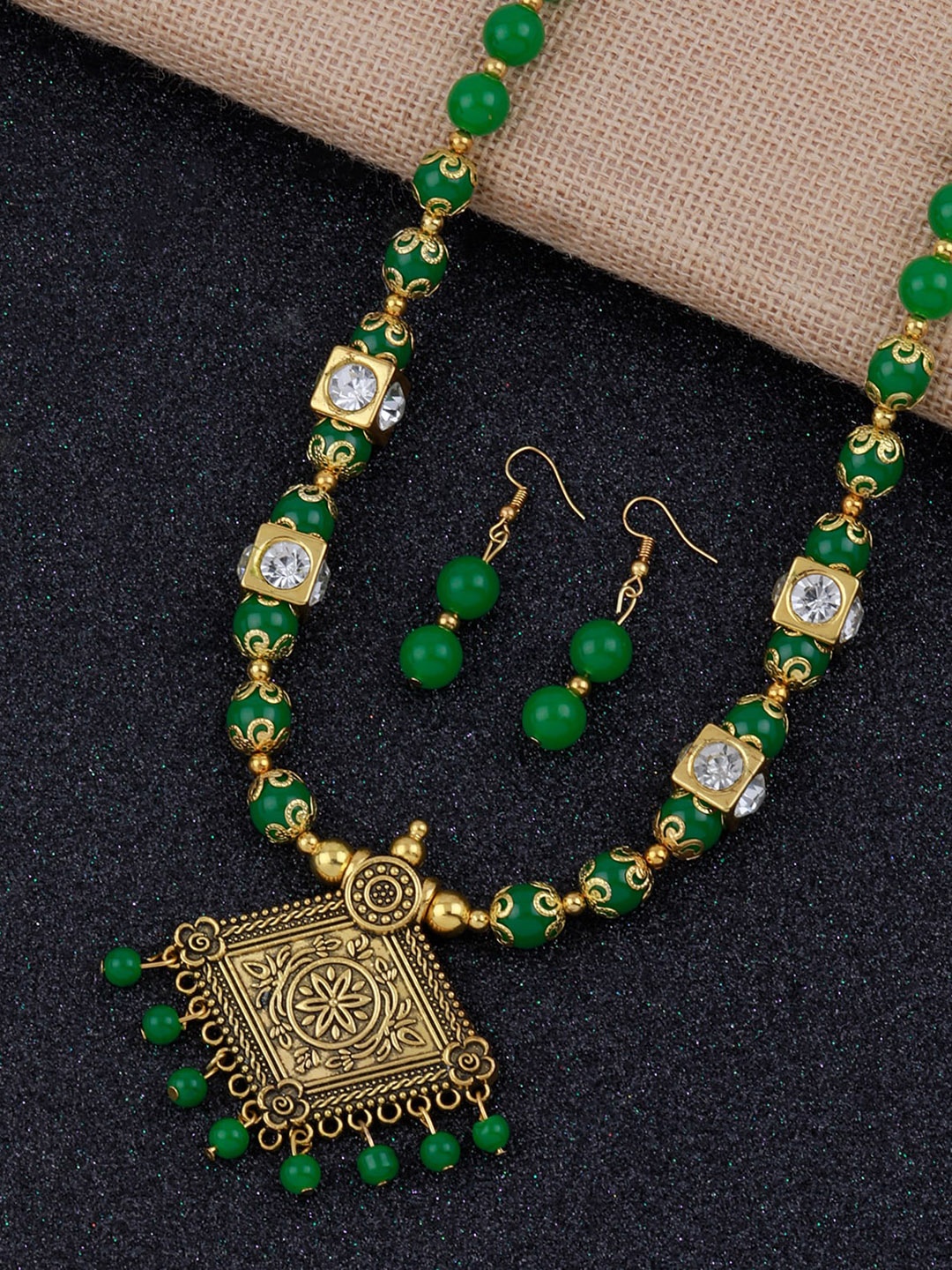 

Silver Shine Gold-Plated Green Stone studded & Beaded Jewellery Set
