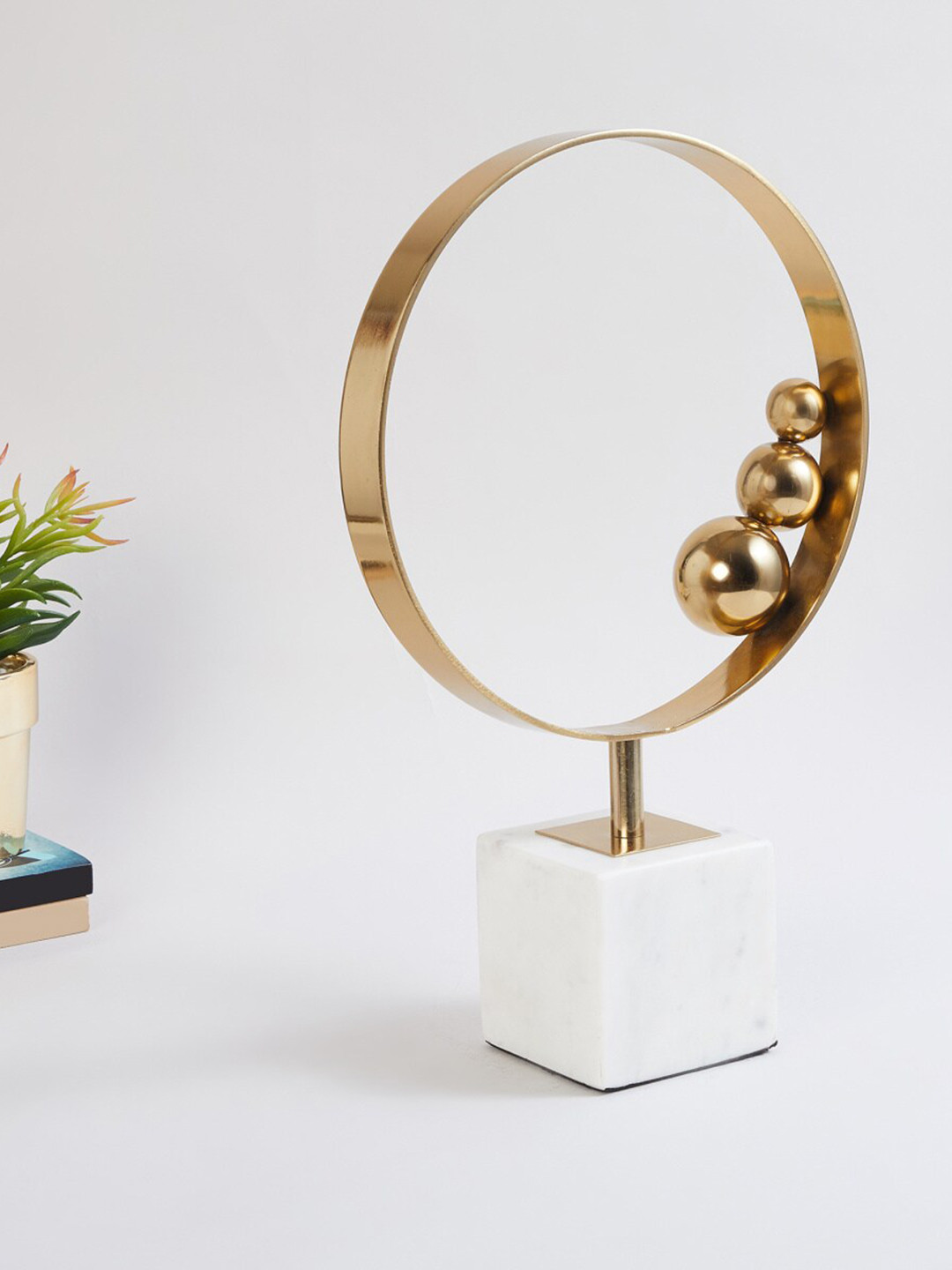 

Home Centre Gold-Toned Round Table Accent With Stand Showpieces