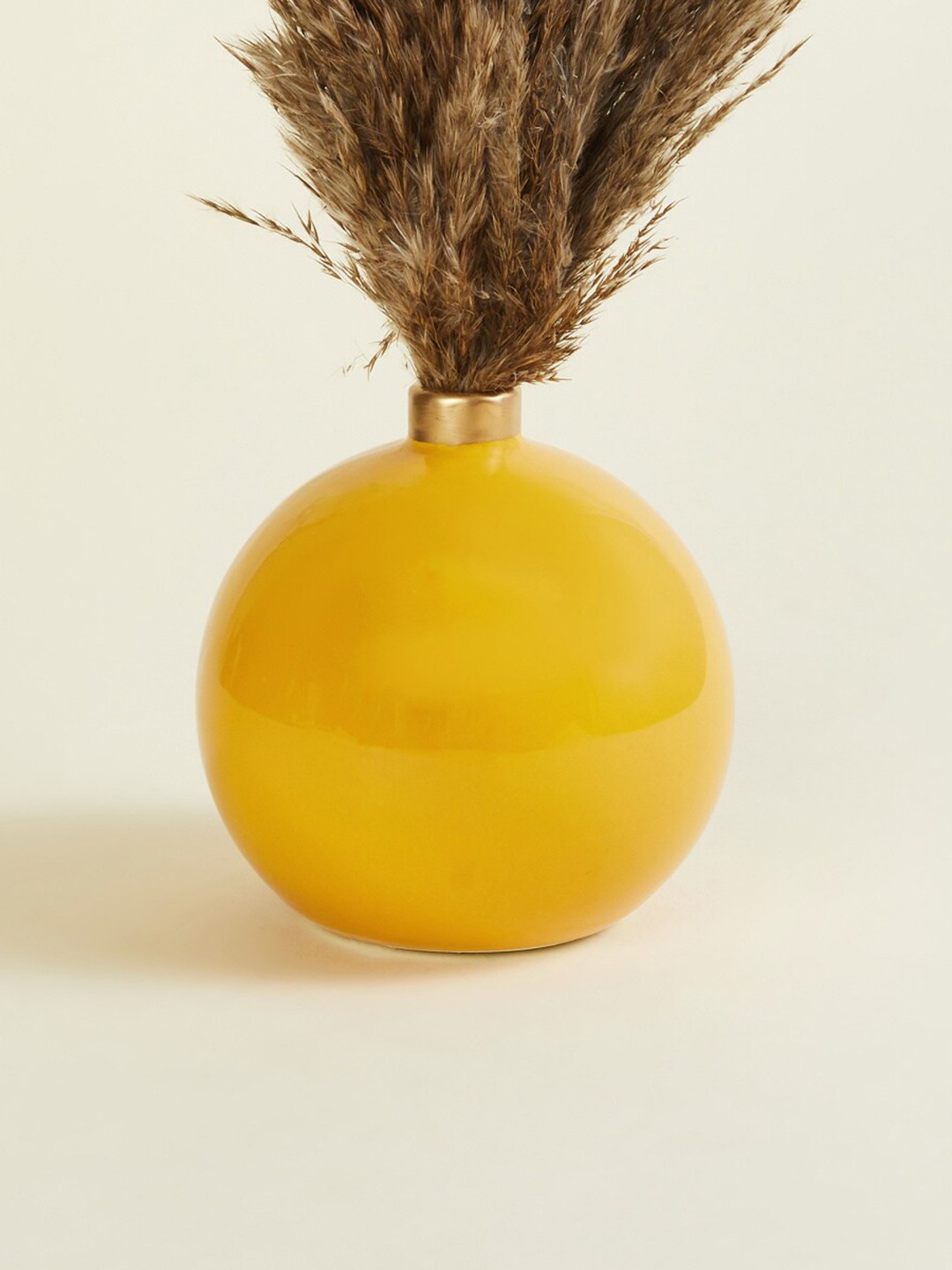 

Home Centre Yellow Solid Ceramic Table Vase