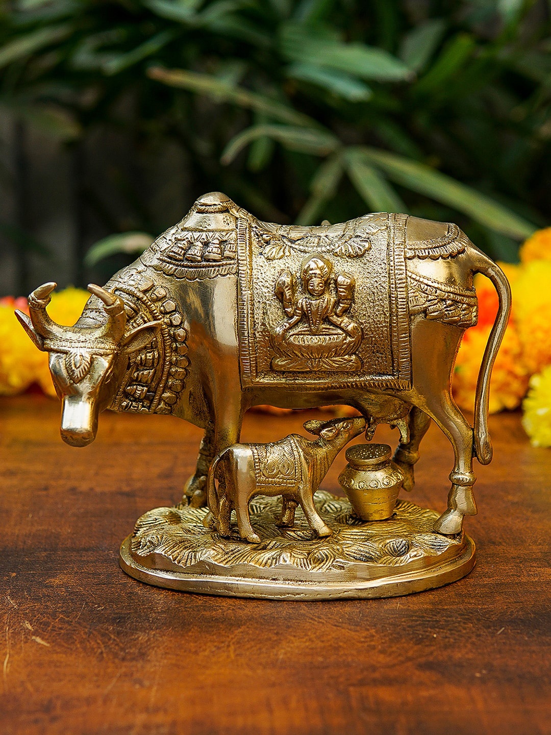 

StatueStudio Gold Toned Cow and Calf Statue With Engraved Laxmi Idol Showpiece