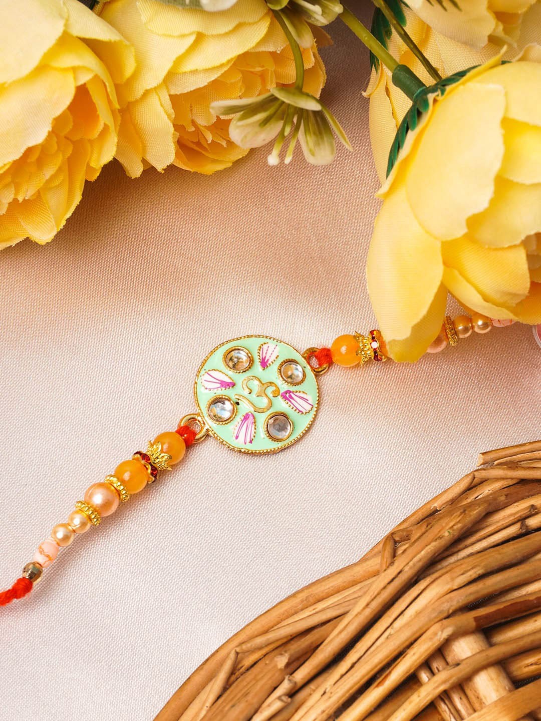 

Urmika Women Green & Gold-Toned Meenakari Rakhi With Roli Chawal