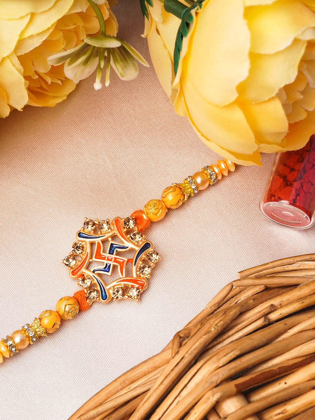 

Urmika Yellow & Orange Beaded Thread Rakhi