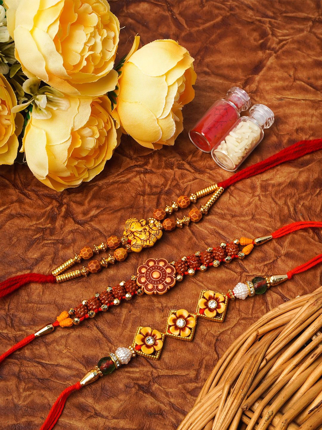 

Urmika Red Set Of 3 Yellow Ganesh Flower Rakhi