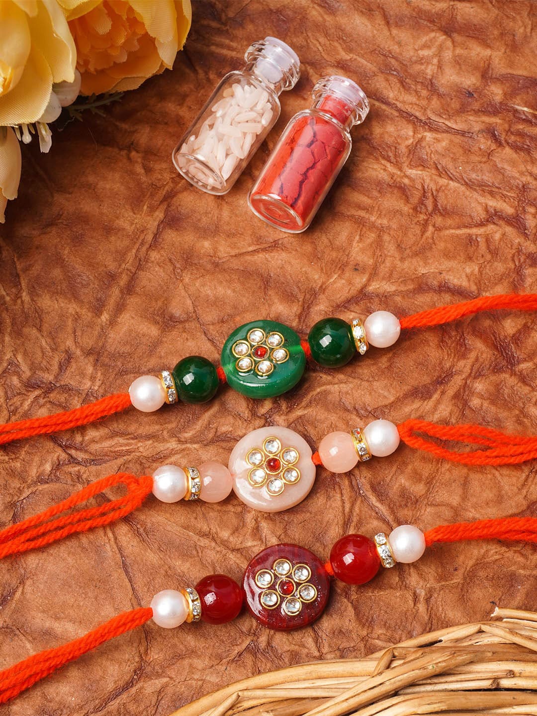 

Urmika Unisex Red Green Off-White Set of 3 kundan Beaded Rakhi With Roli & Chawal