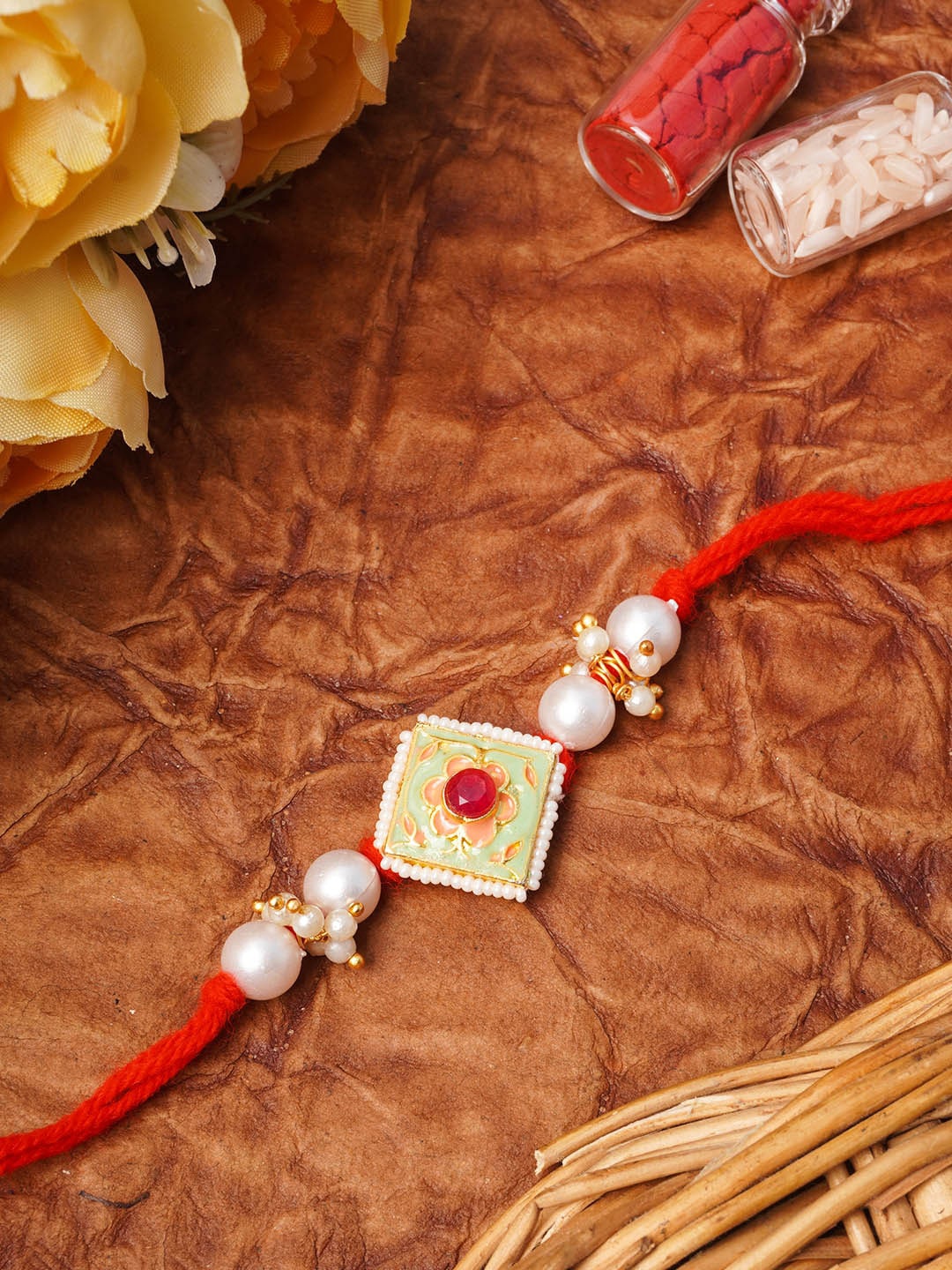 

Urmika Red Meenakari Pearl Rakhi Roli & Chawal