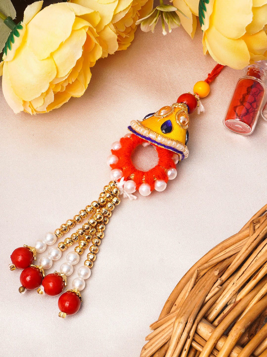 

Urmika Red & Yellow Lumba Rakhi for Bhabhi With Roli & Chawal