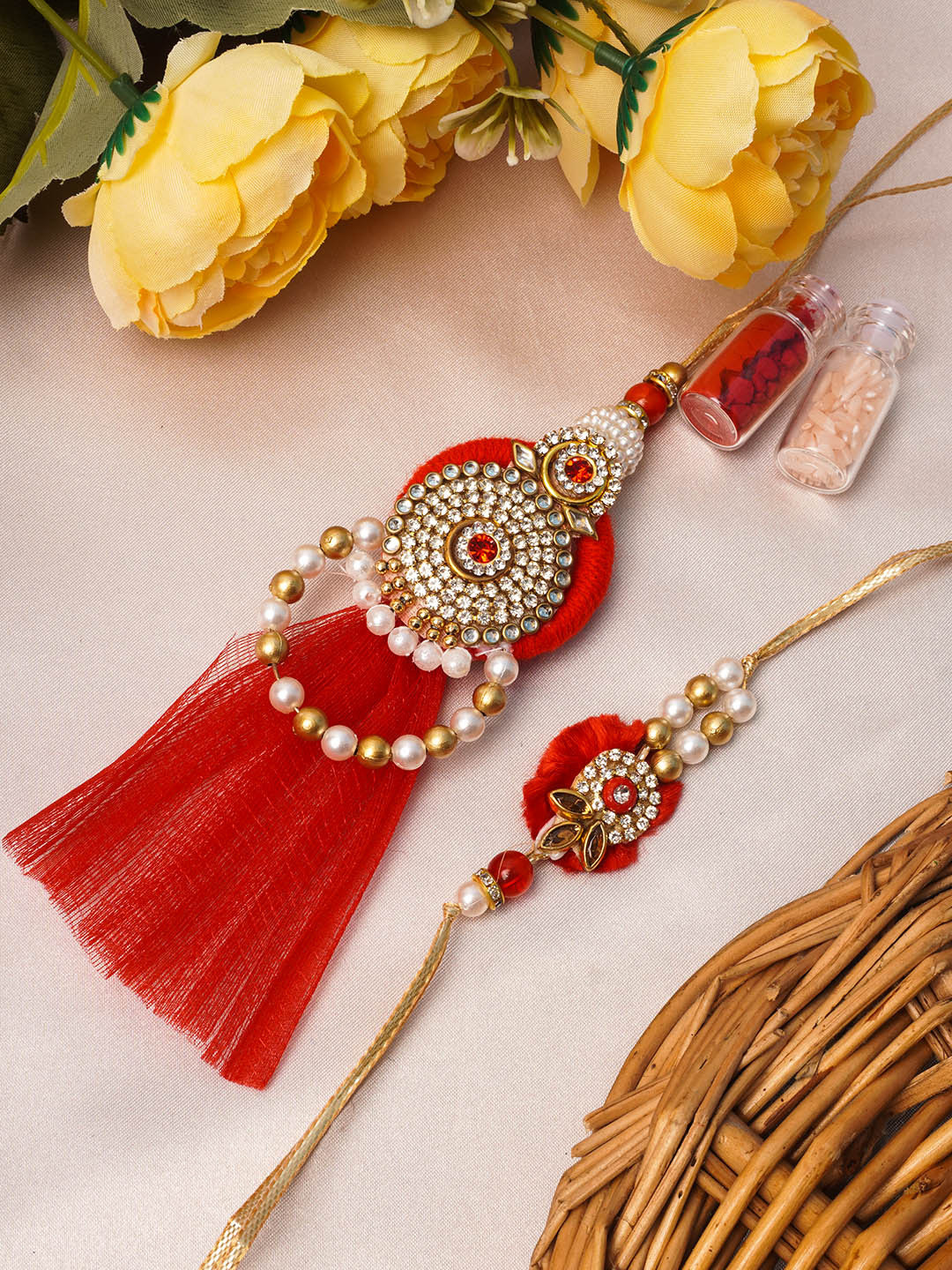 

Urmika Set of 2 Pink & Gold Bhaiya Bhabhi Lumba Rakhi with Roli & Chawal