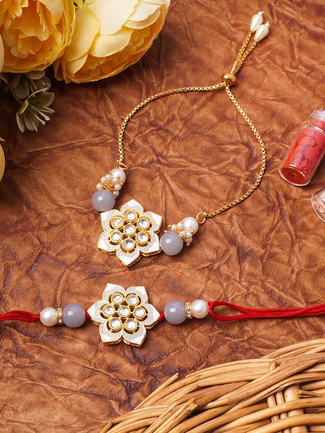 

Urmika Set Of 2 Red & White Kundan-Studded & Pearl Beaded Rakhi