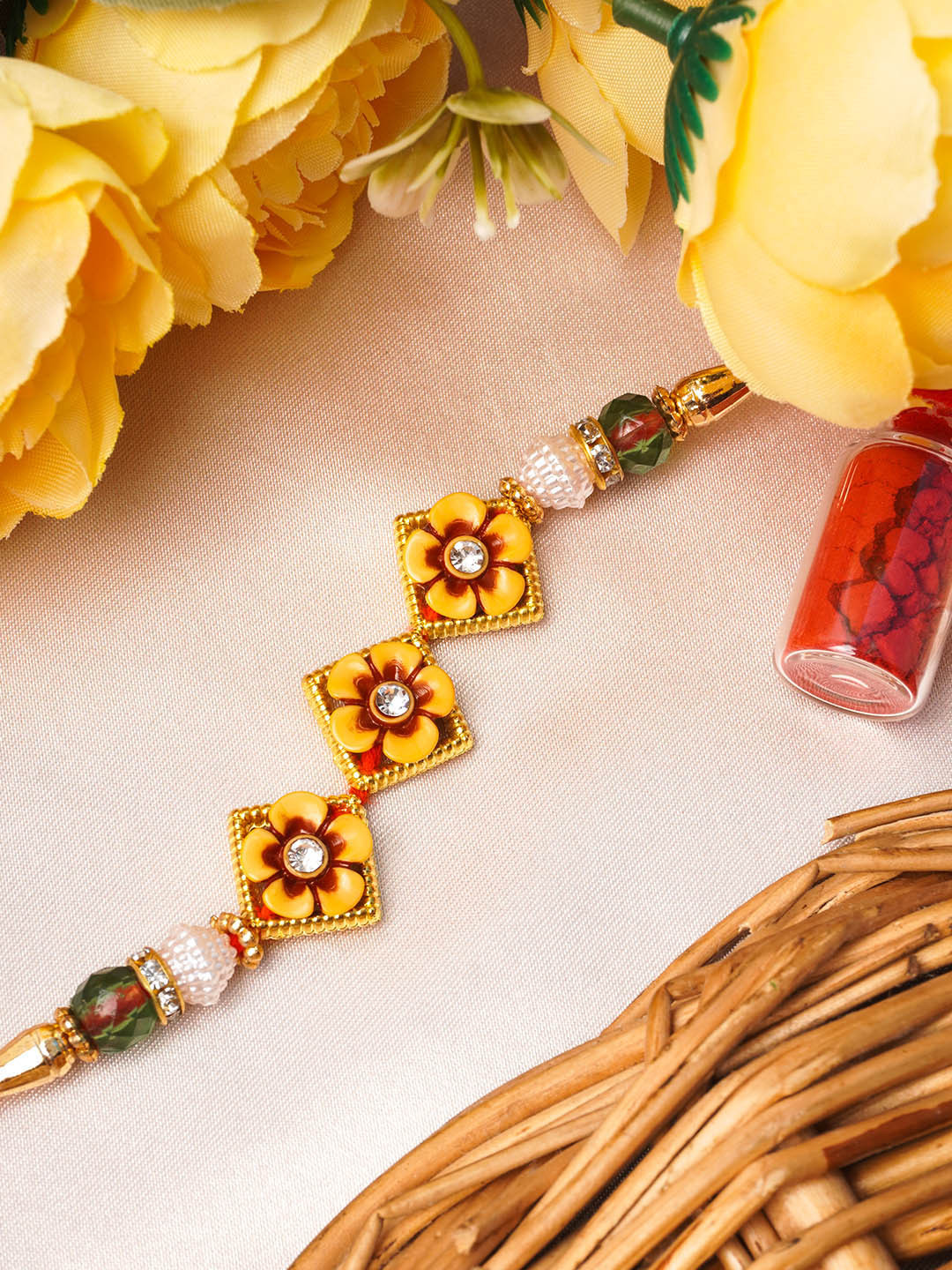 

Urmika Yellow Floral Rakhi & Roli Chawal