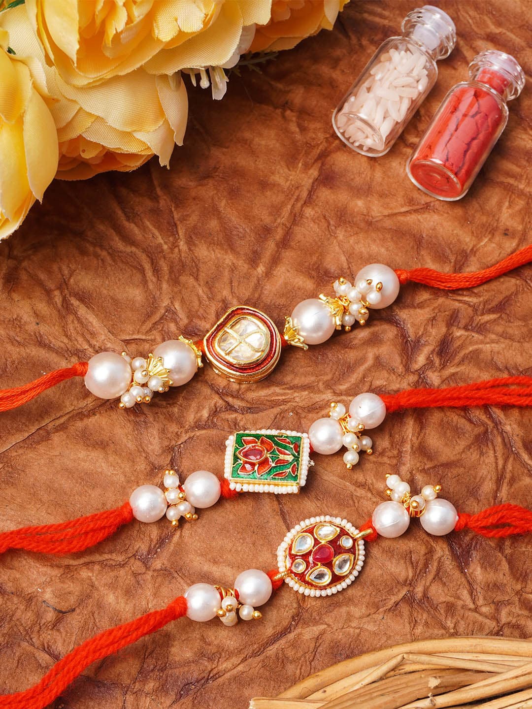 

Urmika Adults Set Of 3 Meenakari Kundan Rakhi With Roli & Chawal, Red