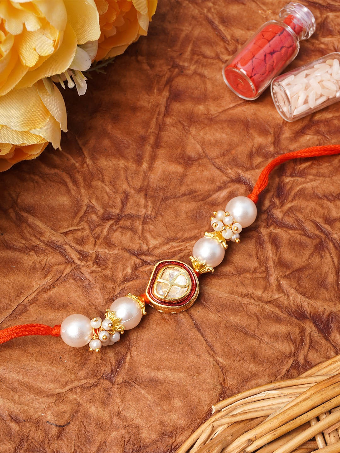 

Urmika Red & Gold-Toned Beaded Thread Rakhi