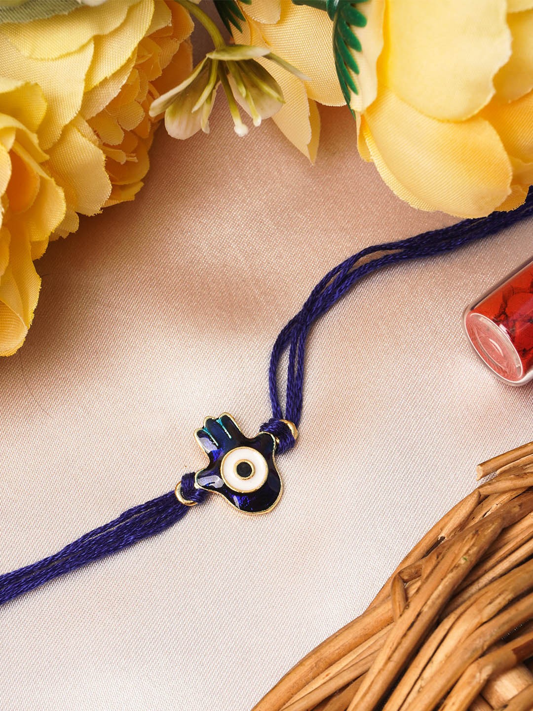 

Urmika Blue and Off-White Rakhi With Roli Chawal