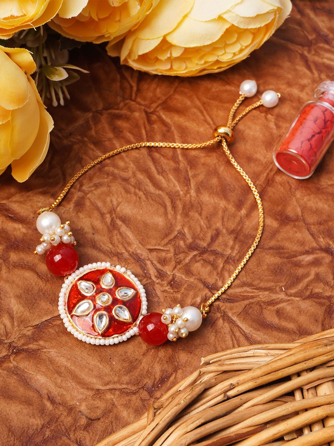 

Urmika Red & Gold-Toned Meenakari Kundan Studded Rakhi