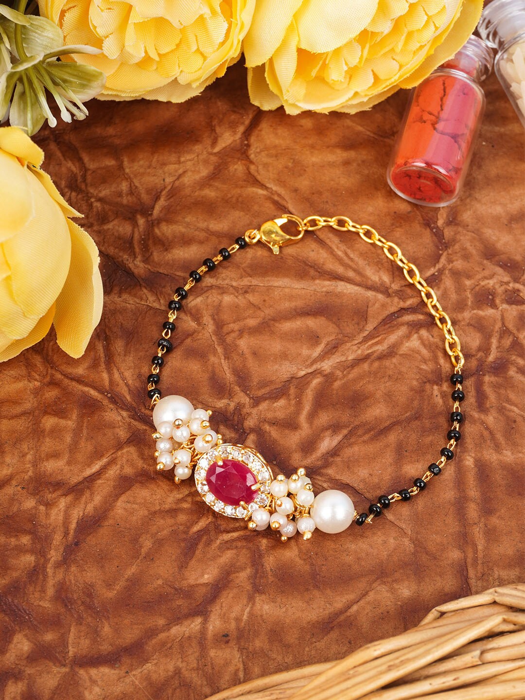 

Urmika Red & Black Stone-Studded Mangalsutra Bracelet Rakhi