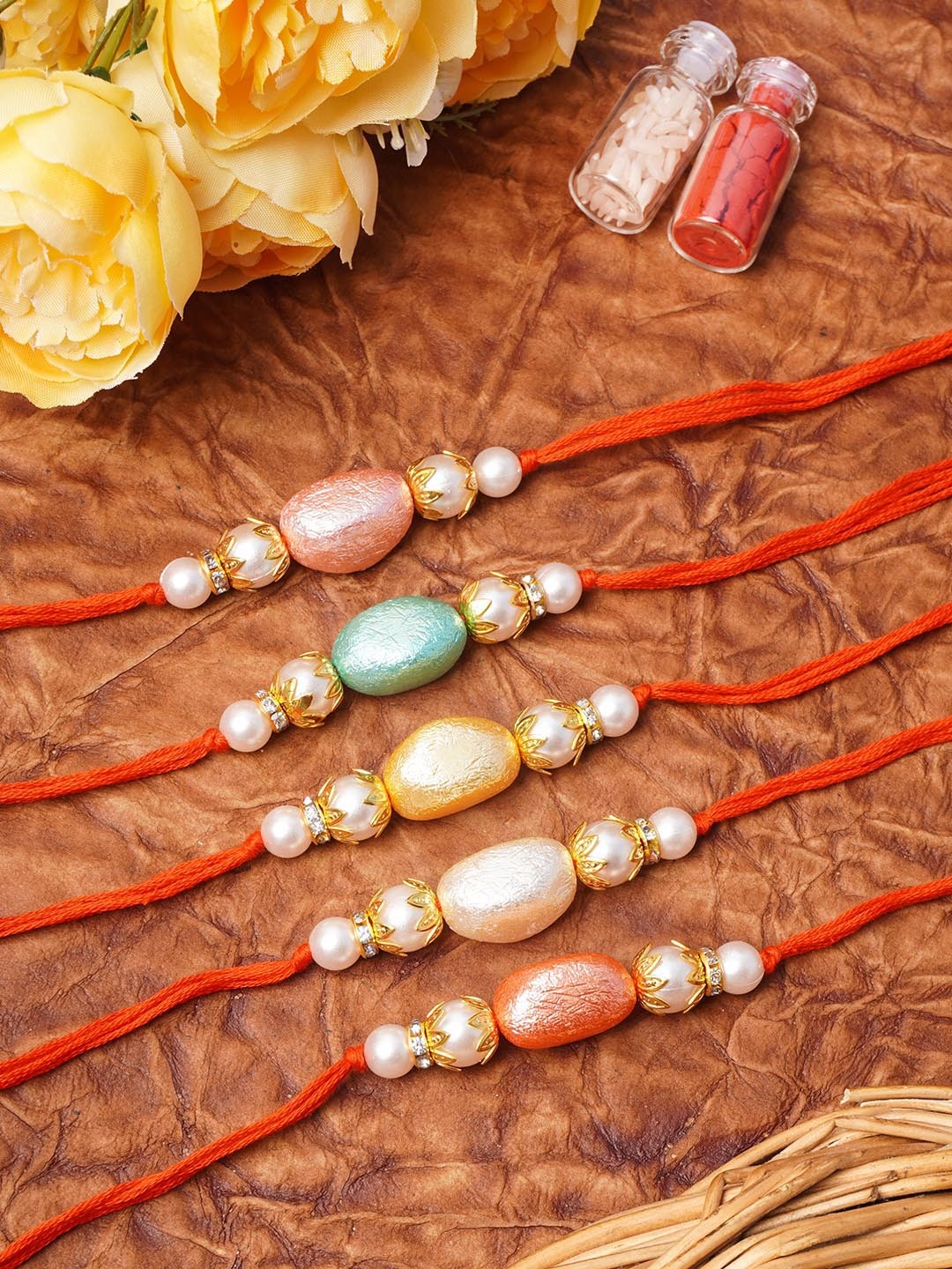 

Urmika Pack of 5 Pearl Beaded Rakhi with Roli and Chawal, Pink