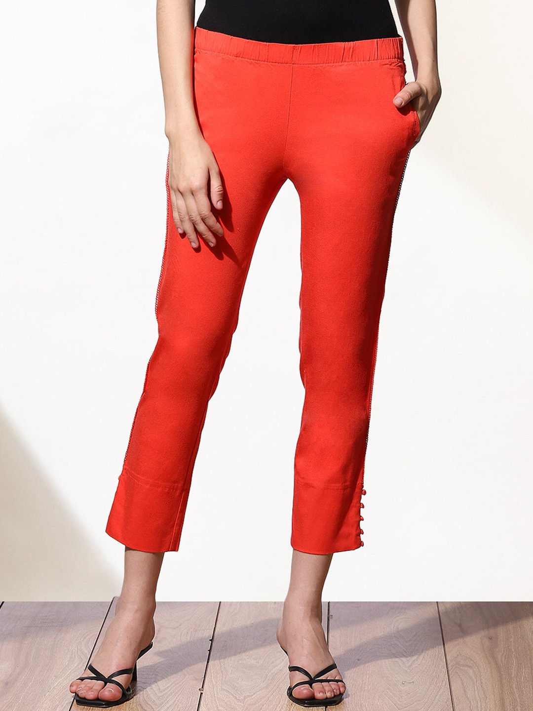 

Lakshita Women Orange Solid side Seam Detailed Capris
