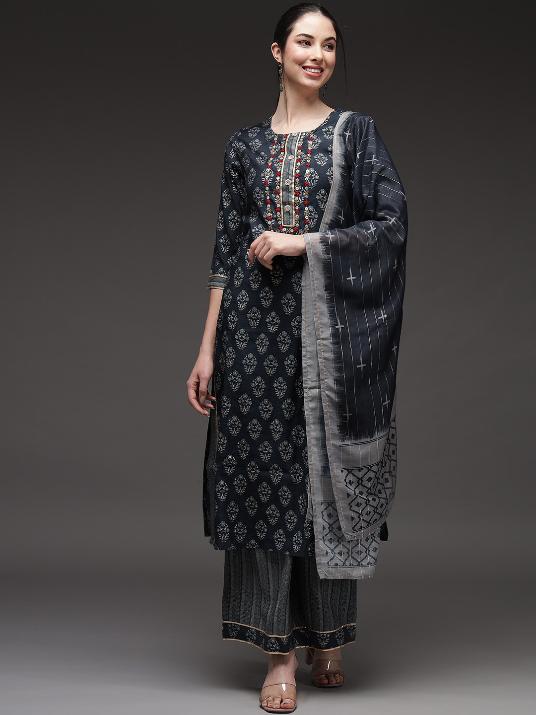 

Nehamta Women Blue Ethnic Motifs Yoke Design Layered Sequinned Kurta with Palazzos & With Dupatta