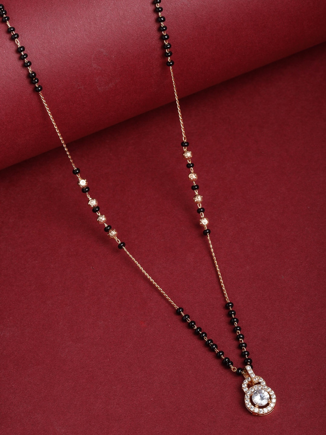 

PANASH Gold-Plated White AD-Studded & Black Beaded Mangalsutra