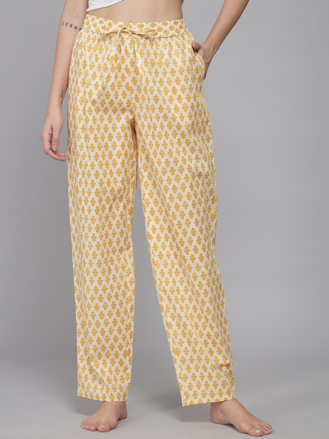 

Shararat Women Off White & Yellow Printed Lounge Pants