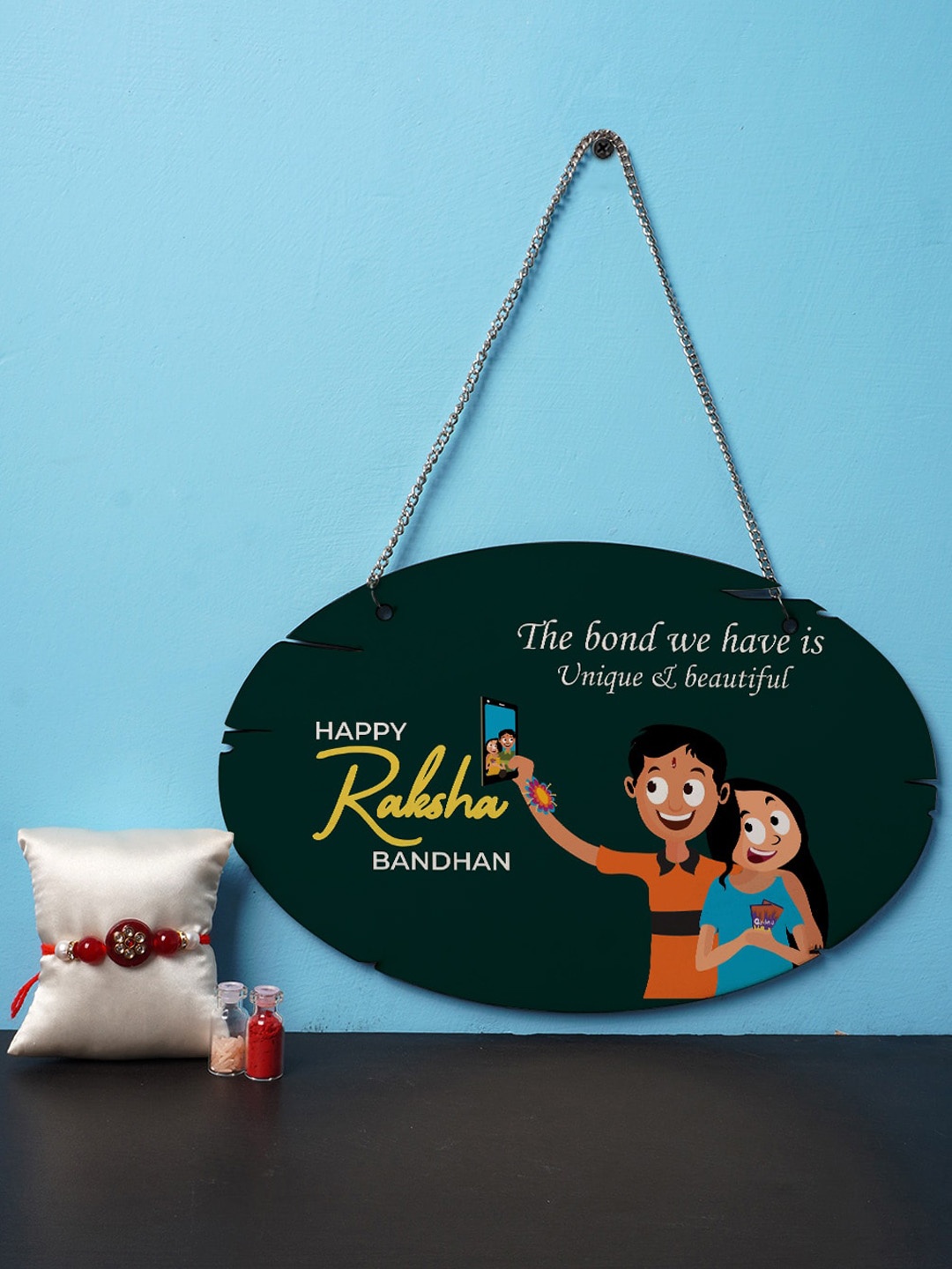 

Crazy Corner Red Rakhi & Hanging Wall Art Combo With Roli Chawal