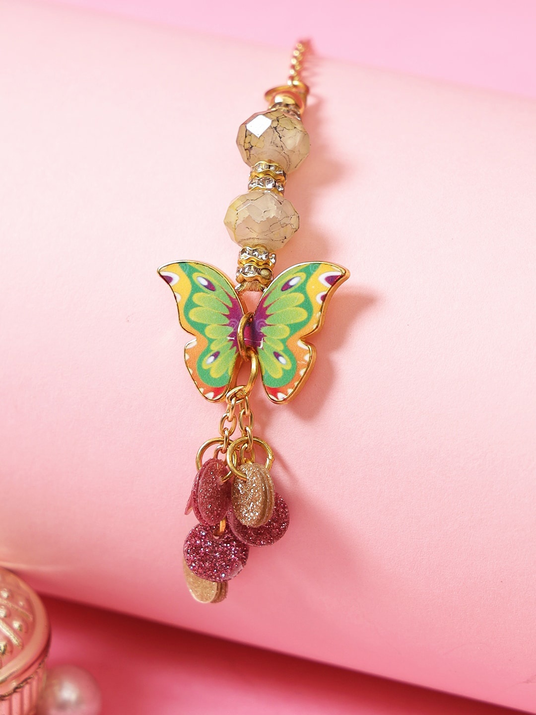 

Aapno Rajasthan Women Green Beaded Butterfly Thread Rakhi