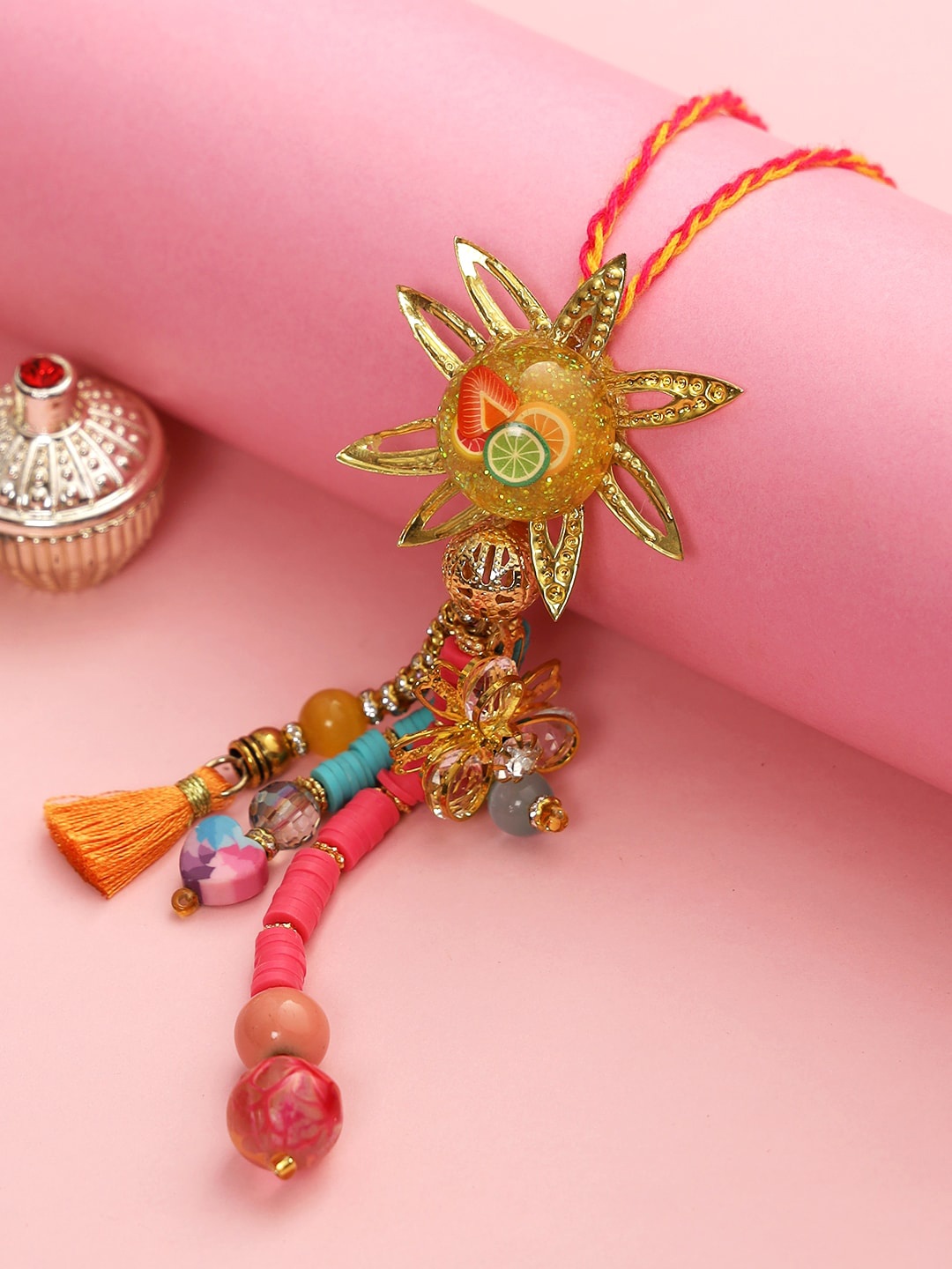 

Aapno Rajasthan Women Pink & Yellow Beaded Star Lumba Rakhi