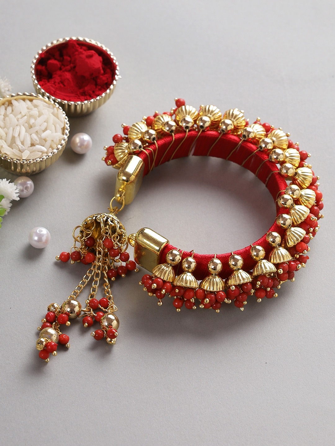 

Aapno Rajasthan Women Red Lumba Bracelet Rakhi