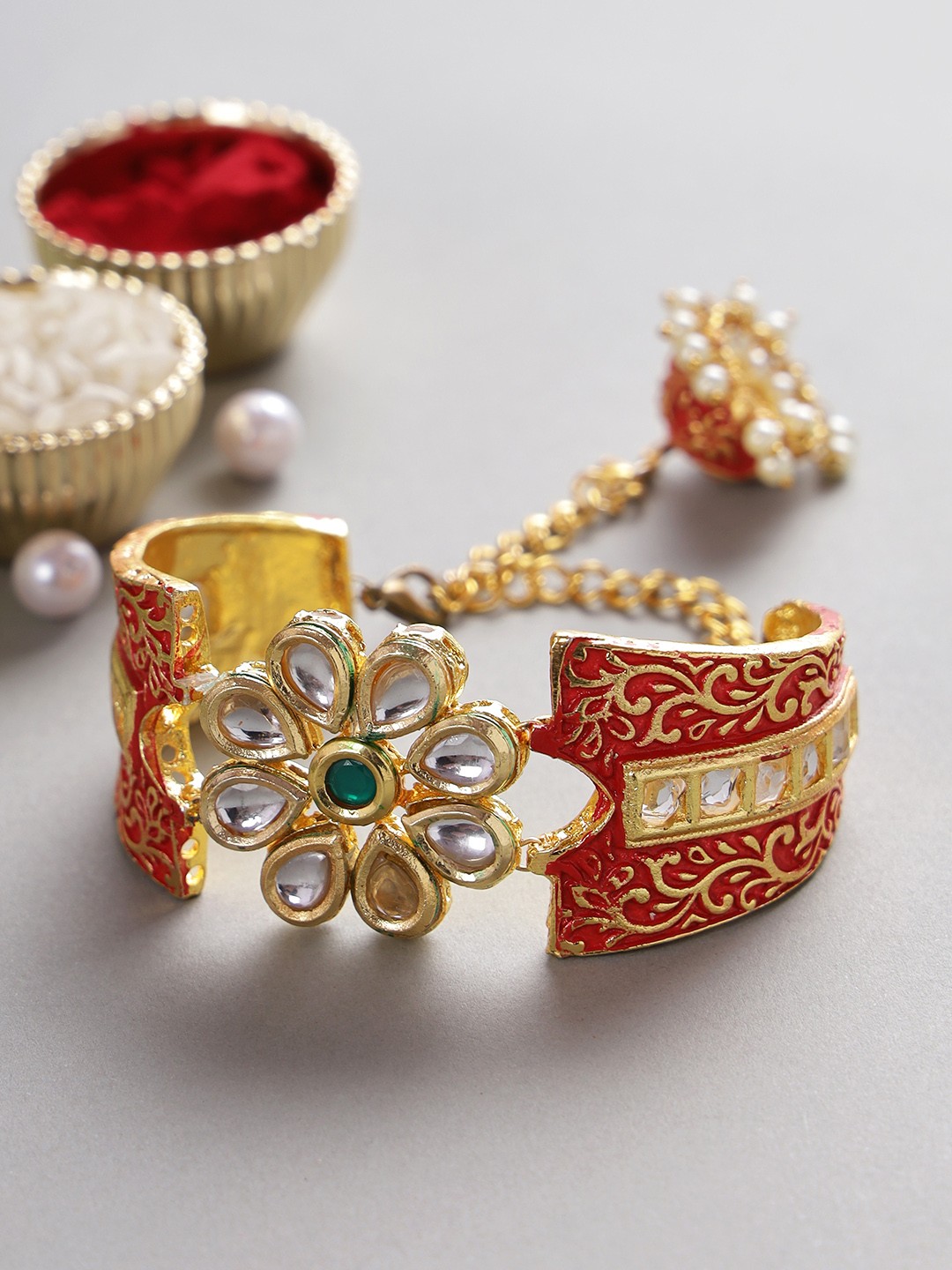 

Aapno Rajasthan Red & Gold-Toned Kundan Bracelet Lumba Rakhi Set
