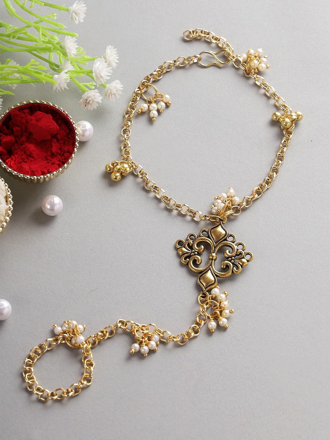 

Aapno Rajasthan Gold-Toned Hathphool Rakhi