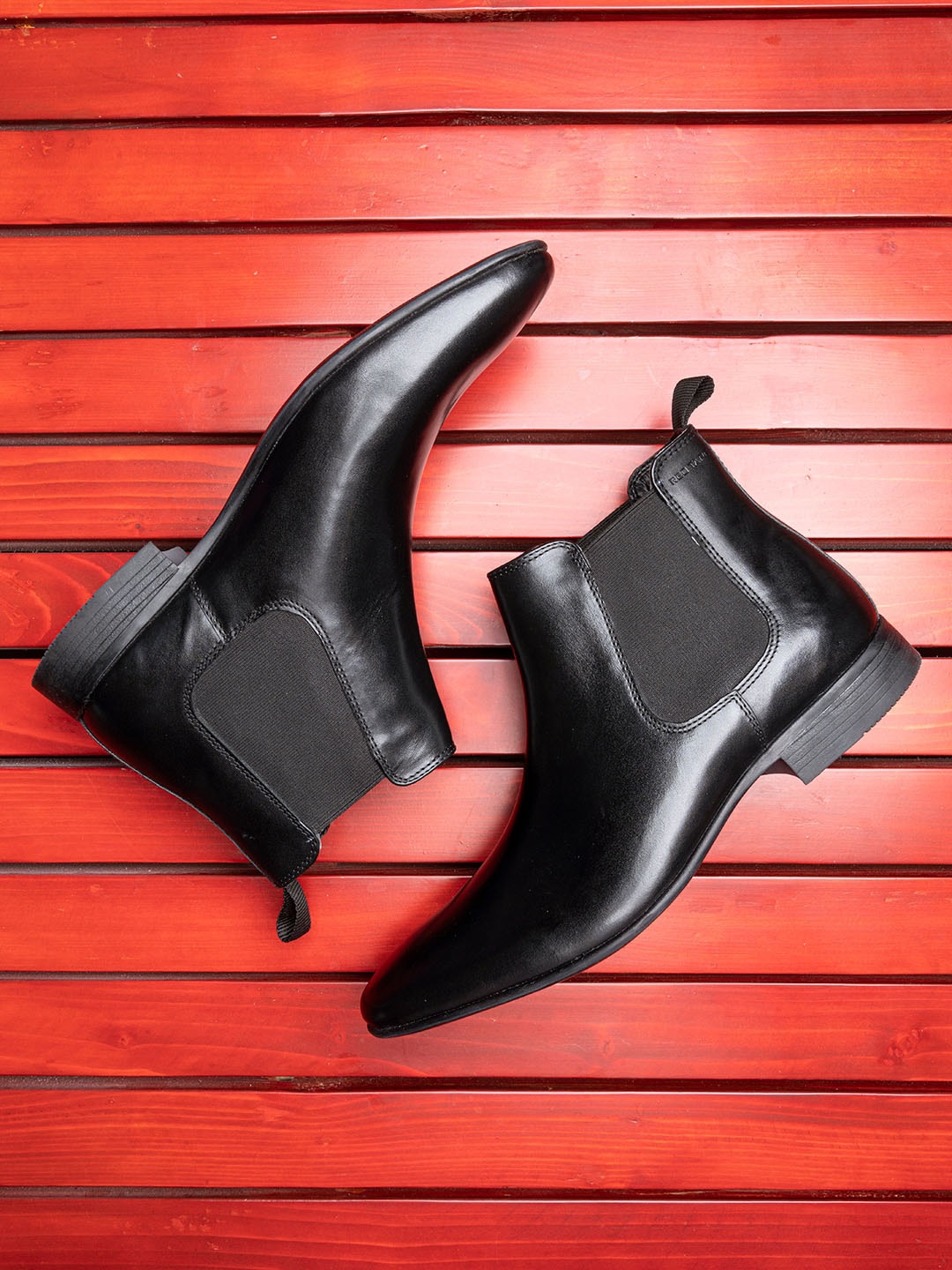 

Red Tape Men Black Solid Mid Top Chelsea Boots