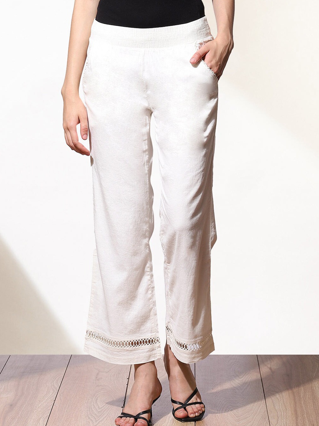 

Lakshita Women White Embroidered Palazzos