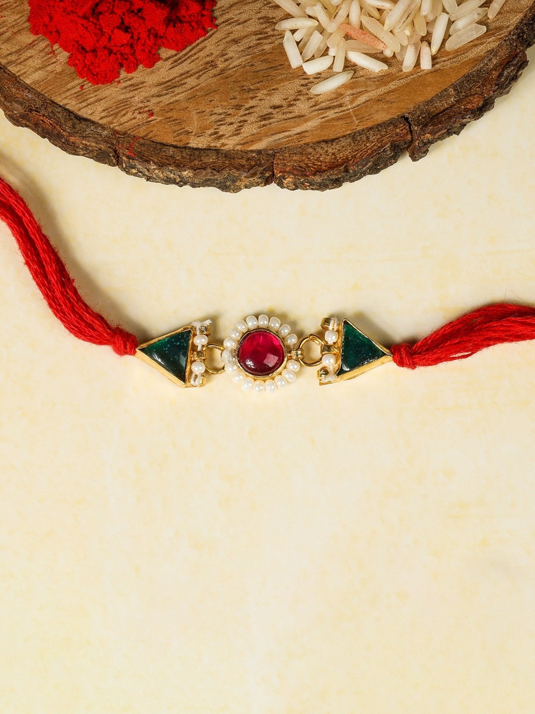 

AURAA TRENDS 22KTGold-Plated Kundan Rakhi, Red